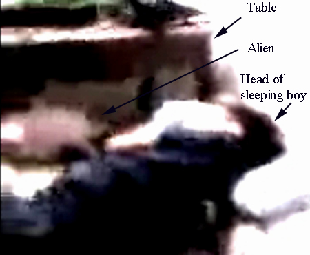 Alien looking at sleeping boy (B)