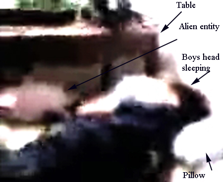Alienlooking at sleeping boy (C)