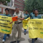 Cops escort Greenpeace activists from   the Science and Tech Ministry